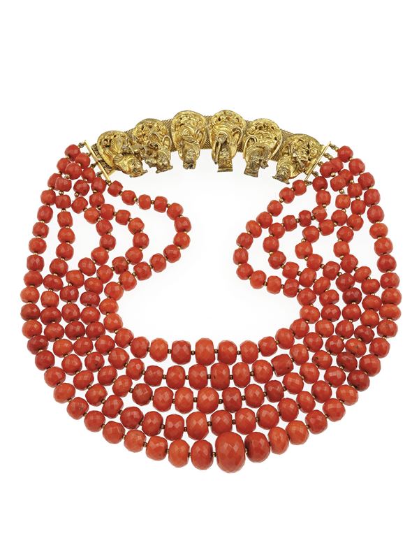 Five-strands of coral beads and gold necklace