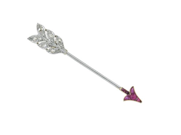 Diamond, ruby and gold "Arrow" brooch. Signed Cartier