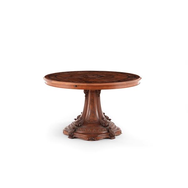 Tavolo circolare in lagno intagliato, lastronato ed intarsiato. XIX secolo