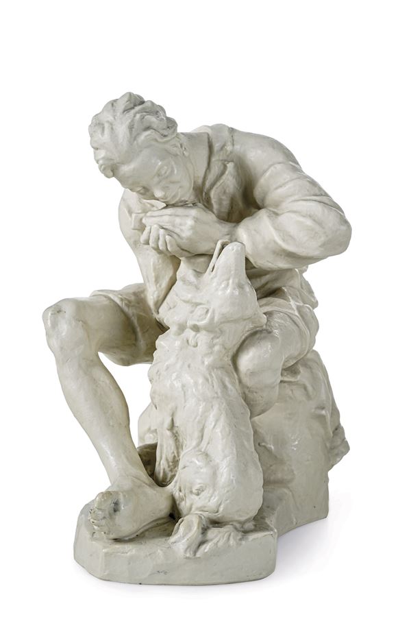 Scultura “Suonatore d’armonica con cane” Germania, Manifattura Rosenthal, dopo il 1936 Modello di Elisabeth Kelling-Höfer, 1936 