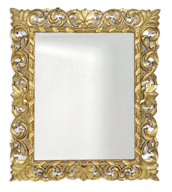 Cornice in legno scolpito e dorato. XIX-XX secolo