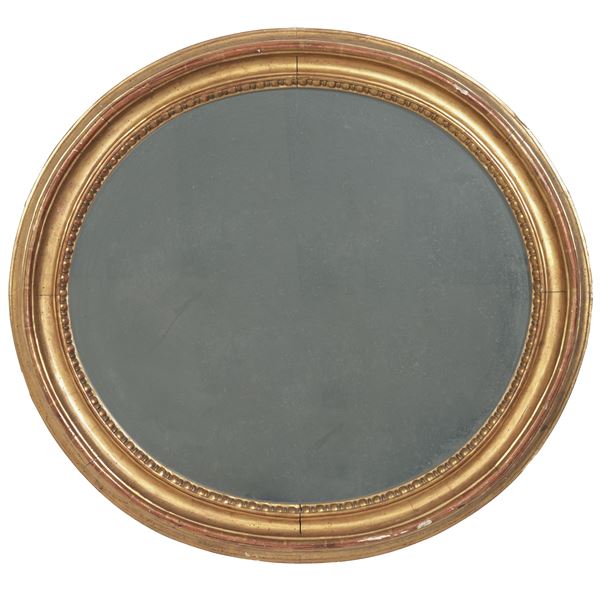 Specchiera ovale in legno dorato. XIX secolo