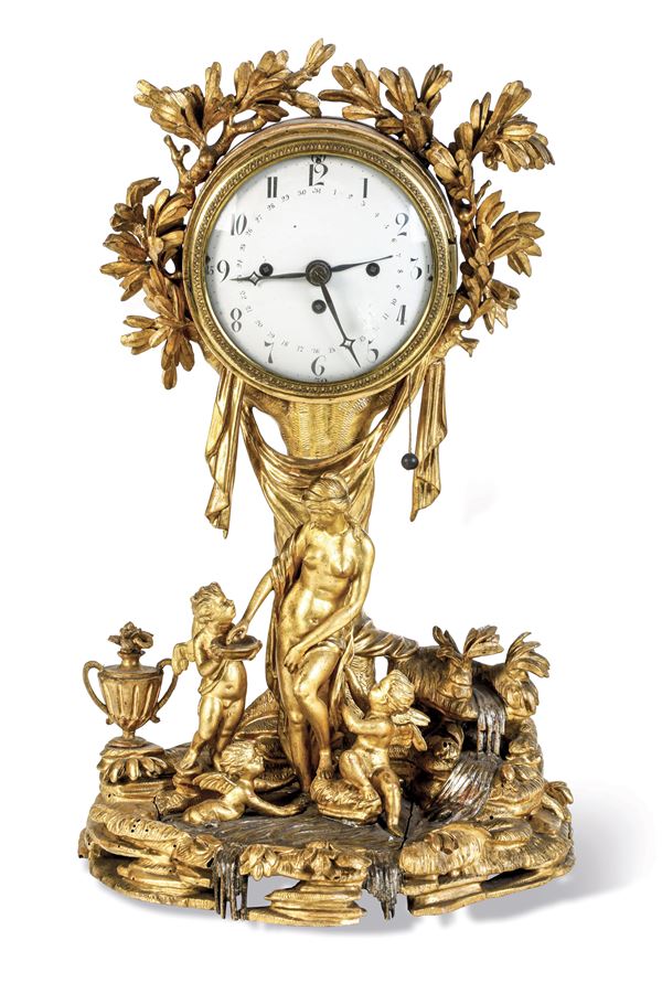 Orologio da tavolo in legno dorato. Probabilmente Austria, XVIII-XIX secolo