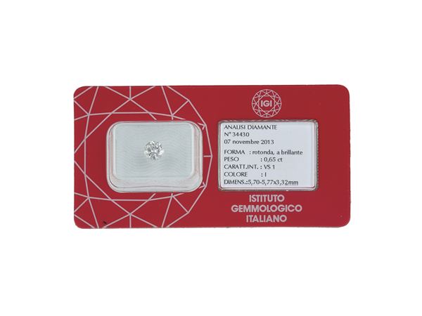 Brilliant-cut diamond weighing 0.65 carats, color I, clarity VS1, fluorescence weak. Gemmological Report IGI Milano n. 34430