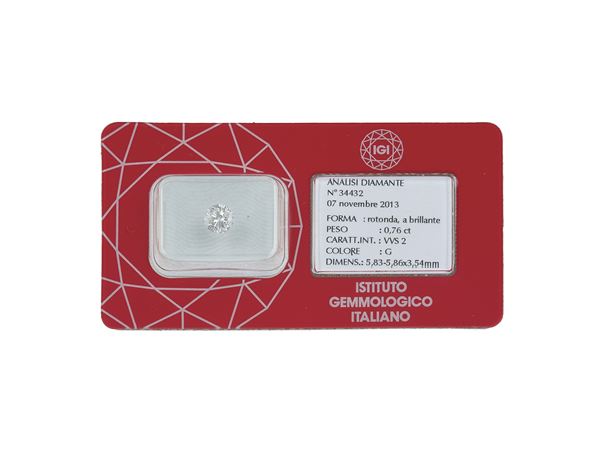 Brilliant-cut diamond weighing 0.76 carats, color G, clarity VVS2, fluorescence weak. Gemmological Report IGI Milano n. 34432
