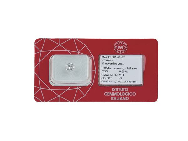 Brilliant-cut diamond weighing 0.66 carats, color G, clarity VS1, fluorescence UV none. Gemmological Report IGI Milano n. 34429