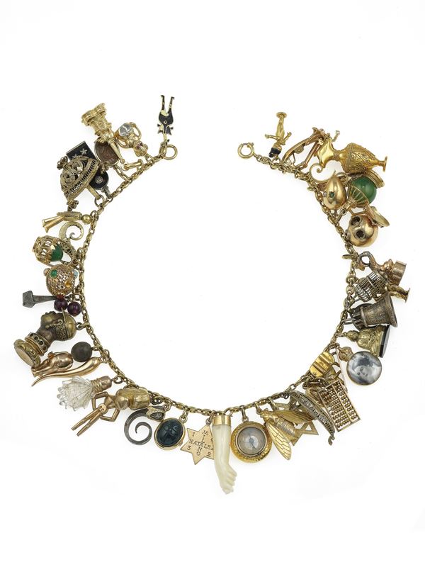 Gold, low-karat gold and silver charms necklace