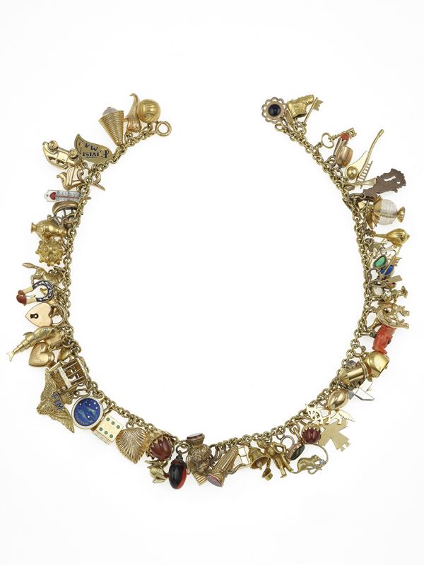 Gold, low-karat gold and silver charms necklace