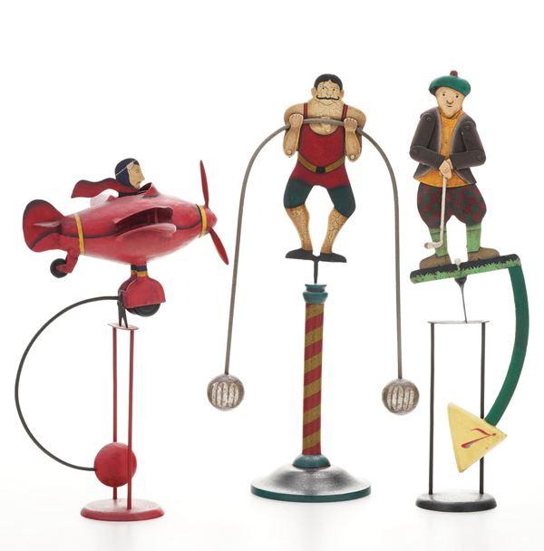 Lotto di tre giocattoli in latta e legno