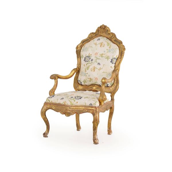 Poltrona in legno intagliato e dorato. XVIII secolo