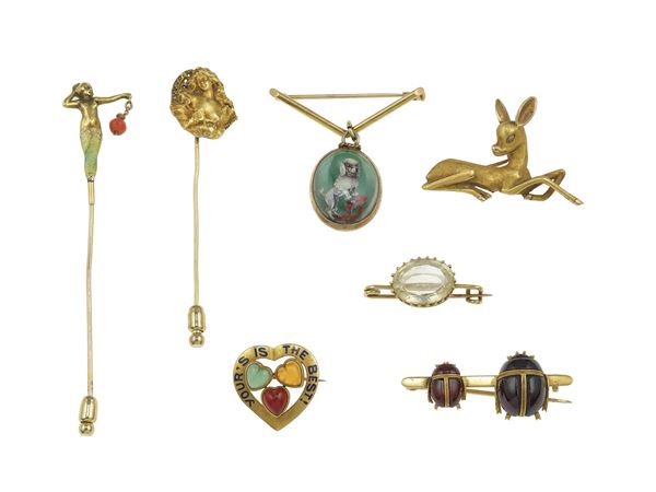 Group of gold, enamel and gem-set pins and brooches