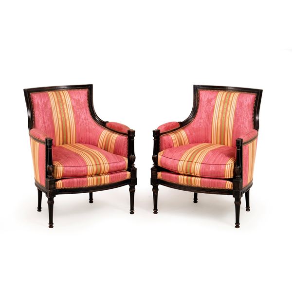 Coppia di poltrone in legno intagliato ed ebanizzato