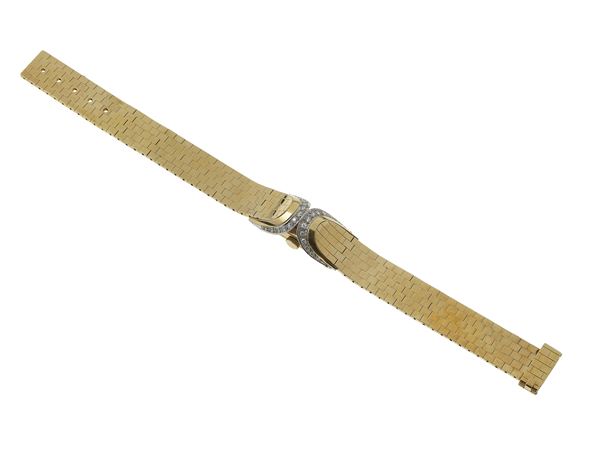 Gold, platinum and diamond lady's wristwatch. The movement has not been tested for the accuracy of time and may need a service