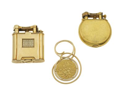 Lotto di fermasoldi in oro 750/1000 e accendini Dunhill, uno con orologio e dedica