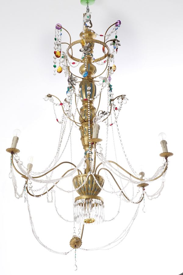 Lampadario in legno e metallo dorati. XX secolo