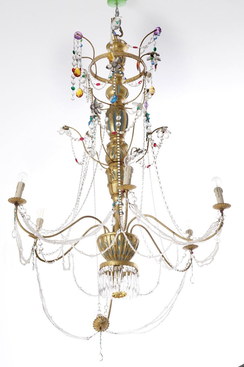 Lampadario in legno e metallo dorati. XX secolo  - Asta Dimore Italiane - Cambi Casa d'Aste