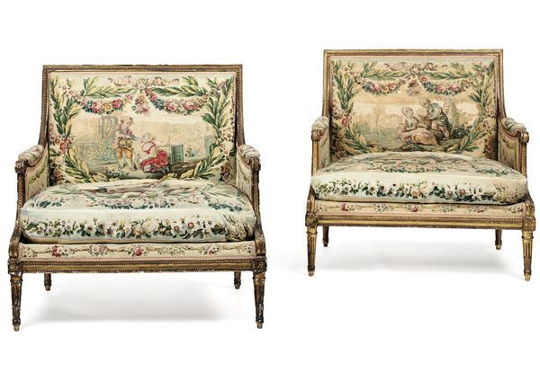 Coppia di bergere e un pouf in legno intagliato e dorato. XIX-XX secolo