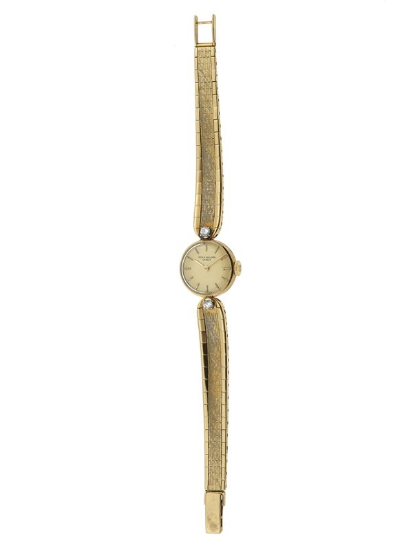 Diamond and gold lady’s wristwatch. Signed Patek Philippe, Genéve. The watch’s movement have not been tested for the accuracy of time and may need a service