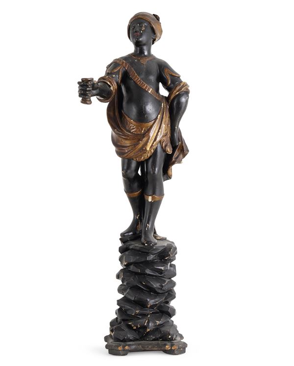 Scultura di moro porta candela in legno ebanizzato e dorato. Veneto, XIX secolo