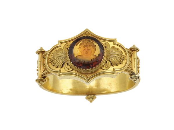 Orange paste cameo and gold bracelet