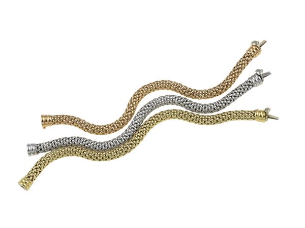 Three gold bracelets. Signed Fope