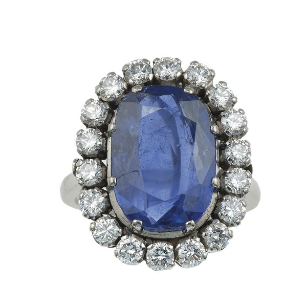 Sri Lanka sapphire weighing approximately 7.20 carats and diamond cluster ring