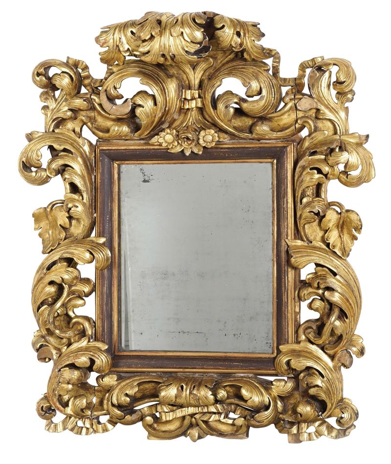 Grande specchiera di gusto barocco in legno scolpito e dorato. XIX secolo  - Auction Antique - Cambi Casa d'Aste
