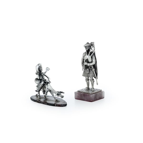 Suonatore di cornamusa e Don Chisciotte. Argenteria italiana del XX secolo