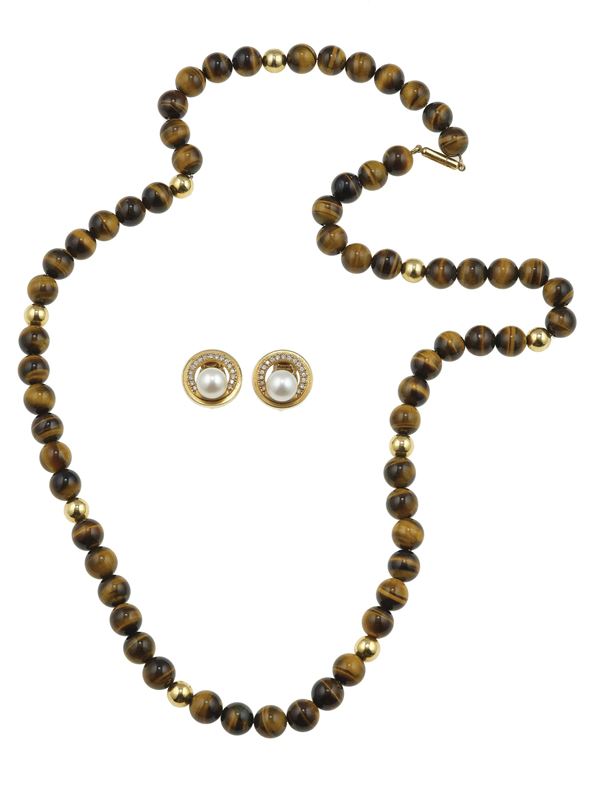 Lotto composto da un paio di orecchini firmati Repossi con perle coltivate ed una collana con boules in occhio di tigre