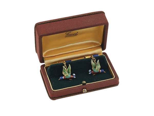Pair of enamel and gold cufflinks. Signed Gucci. Fitted case