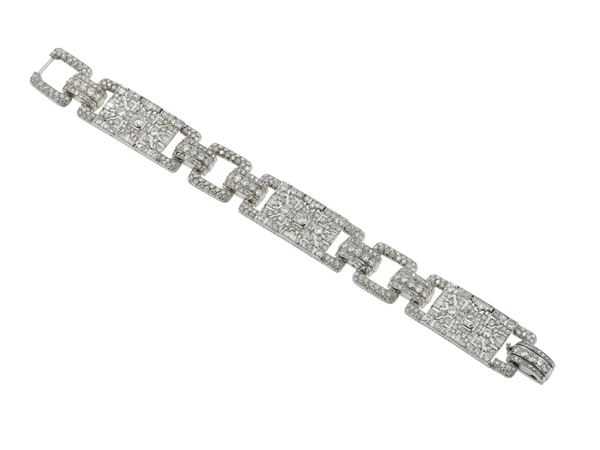 Diamond and platinum bracelet. Case signed A. Cusi, Milano