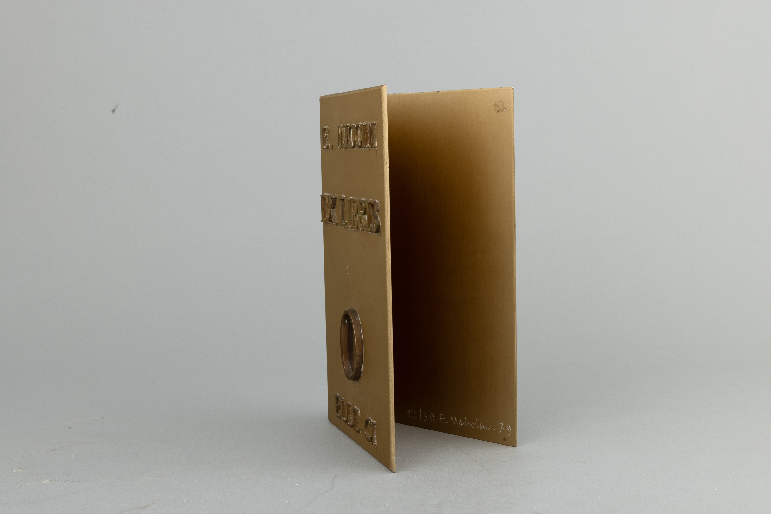 Eugenio Miccini - Ex libris, scultura in bronzo dorato con specchio