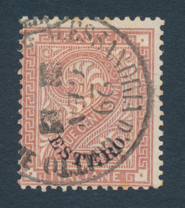 1874 - Regno d’Italia - Uffici Postali all’estero - Levante - Emissioni generali - Francobolli extraterritoriali Estero ottenuti dai De La Rue -  Stampa tipografica in fogli di 200 (due gruppi di 100) presso l’Officina Carte Valori di Torino – Filigrana corona – Dent. 14 – Disegno e incisione: Enrico Repettati e aiutanti – 2 cent. roso bruno usato (Sass. n. 2) - Annullo Postale Circolare dell’ufficio di Alessandria d’Egitto (apertura 1863 - chiusura 1884): ALESSANDRIA D’EGITTO / POSTE ITALIANE / due tasselli al posto dell’anno (R3).