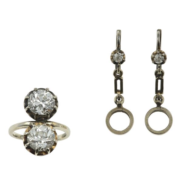 Anello contrariè con due diamanti di vecchio taglio di ct 1.80 circa l'uno, ex orecchini