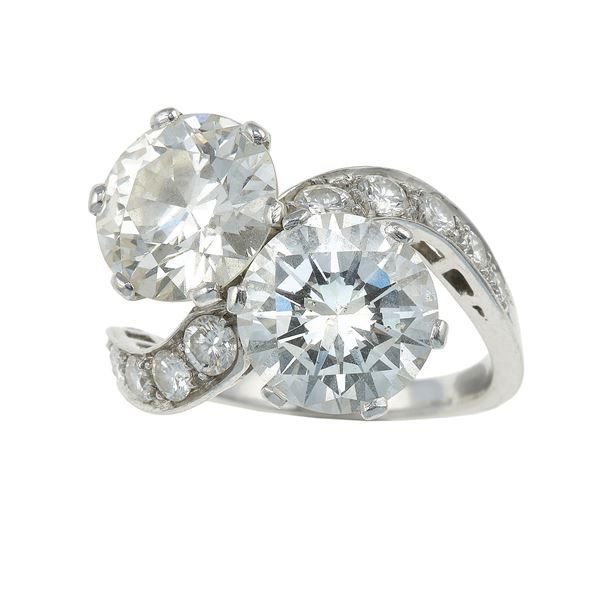 Brilliant-cut diamond and circular-cut diamond weighings 3.00 carats approx each one