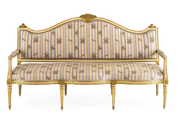 Divano Luigi XVI in legno intagliato, laccato e dorato. XVIII secolo