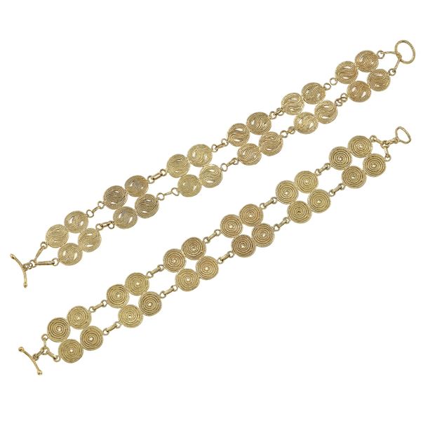 Two of gold bracelets. Signed Bragalini. Damage