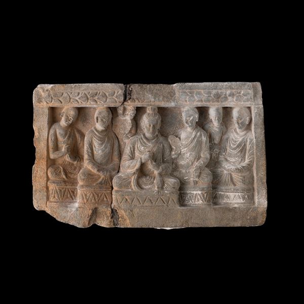 Carved stone relief with central figure of Buddha and acolytes, Gandhara, 4th century