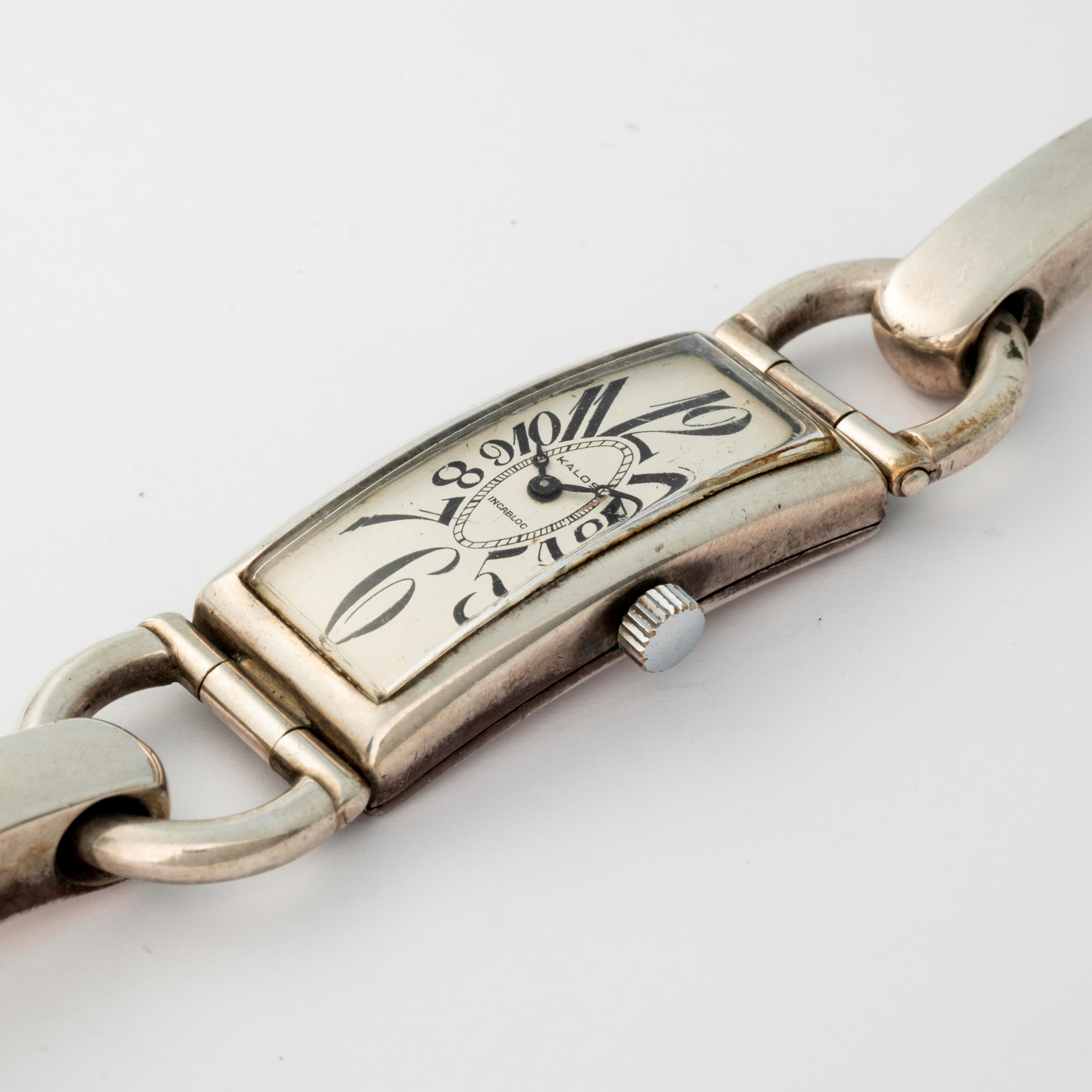Kalos - Orologio Curvex in argento 800 con bracciale integrato, quadrante bianco, circa 1950