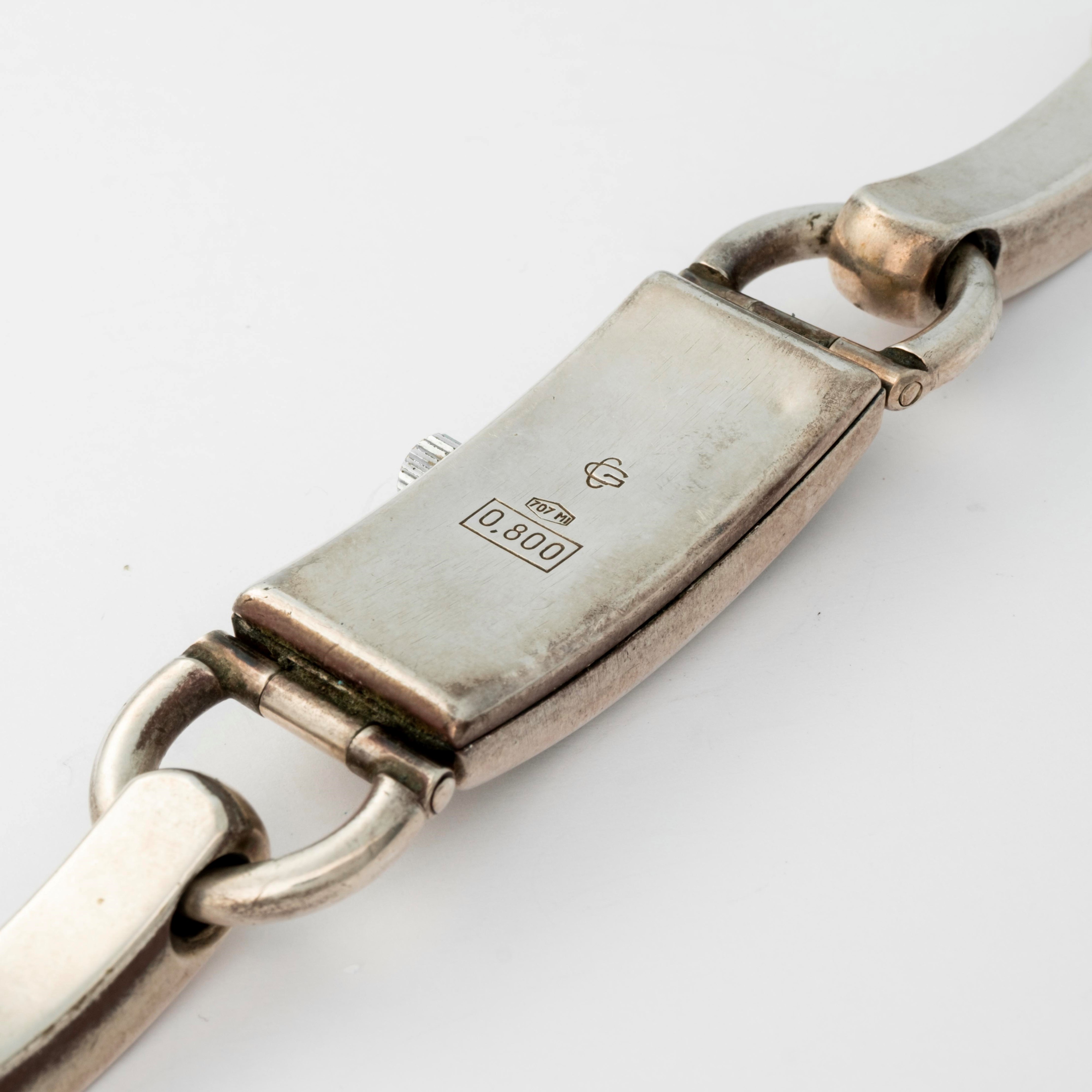 Kalos - Orologio Curvex in argento 800 con bracciale integrato, quadrante bianco, circa 1950
