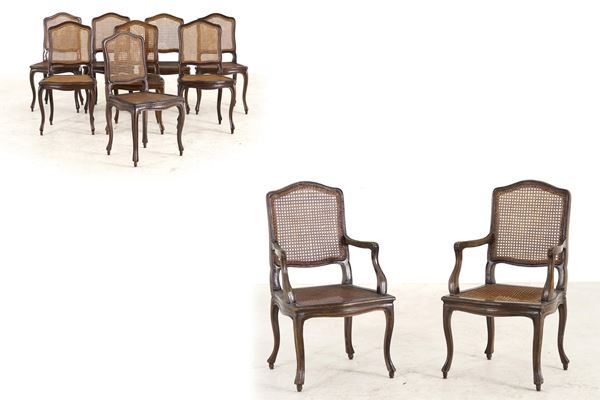 Gruppo di otto sedie e due poltrone di gusto settecentesco in legno intagliato