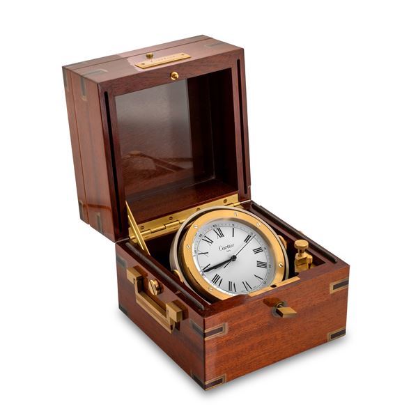 Cartier - Gilded brass tilting marine clock, in lacquered mahogany box, quartz movement, circa 1990