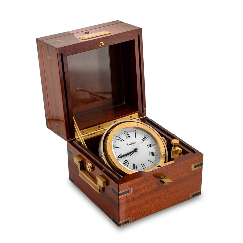 Cartier : Gilded brass tilting marine clock, in lacquered mahogany box, quartz movement, circa 1990  - Auction Watches - Cambi Casa d'Aste