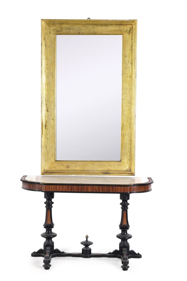 Consolle in legno lastronato ed ebanizzato, XIX secolo, e specchiera in legno dorato, XX secolo
