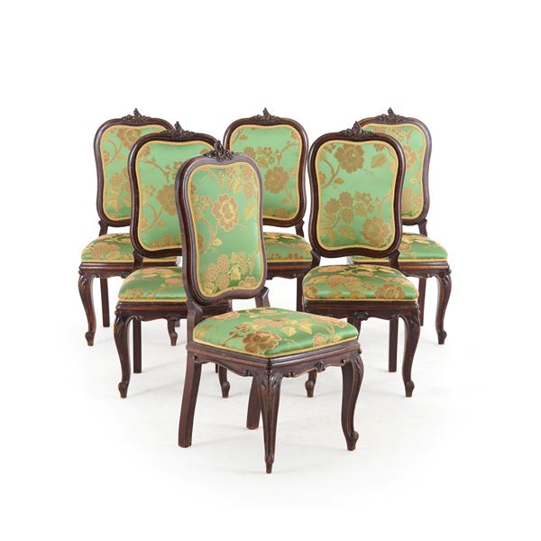 Sei sedie in legno intagliato. XX secolo