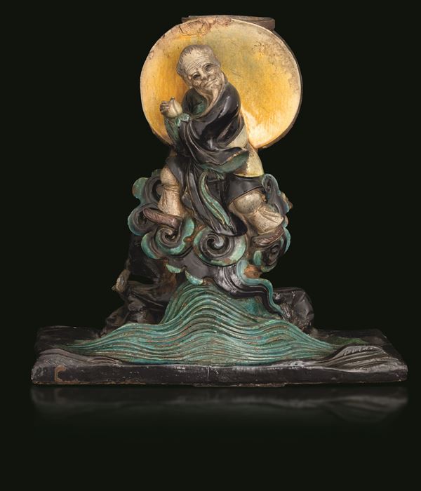 Double-sided Fahua candle holder depicting two stoneware immortals, China, Ming Dynasty, 17th century