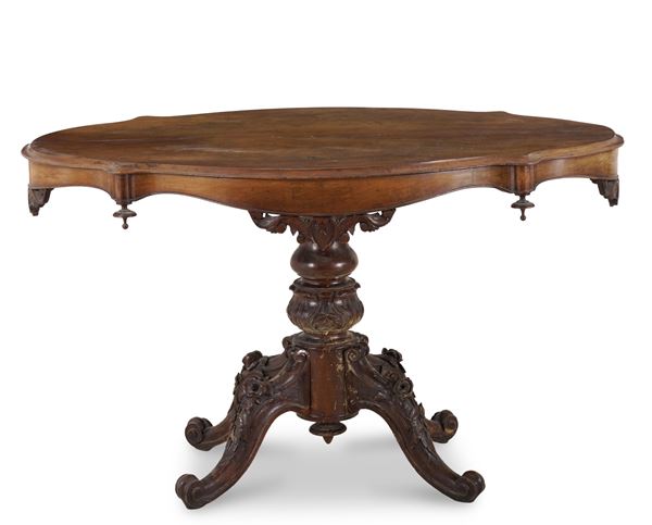 Tavolo Luigi Filippo in legno intagliato. XIX secolo