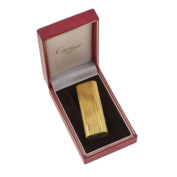 Gold plated lighter. Signed and numbered Cartier Paris E96298. Fitted case, damaged