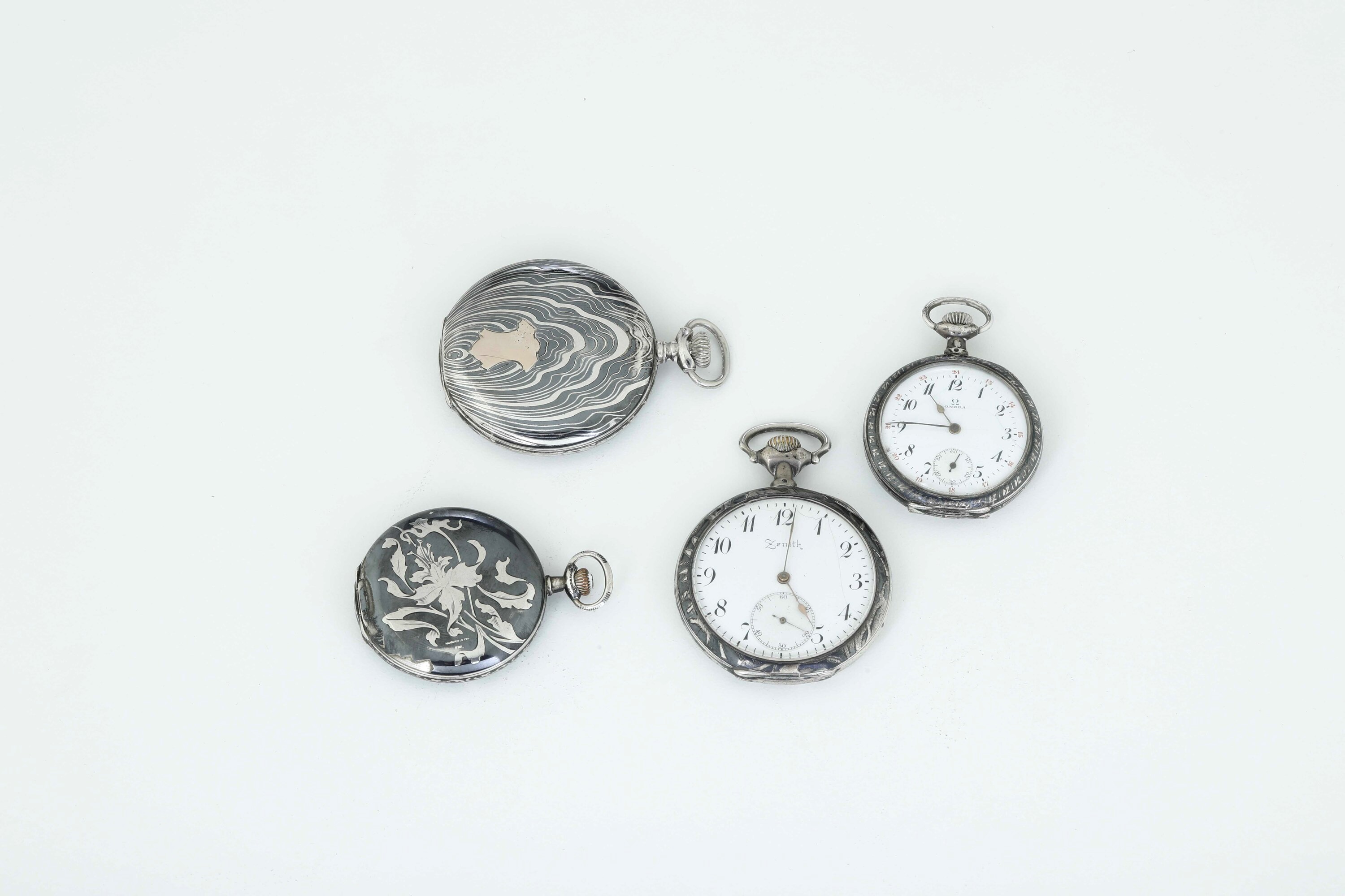 Varie manifatture del XX secolo, Quattro orologi da tasca