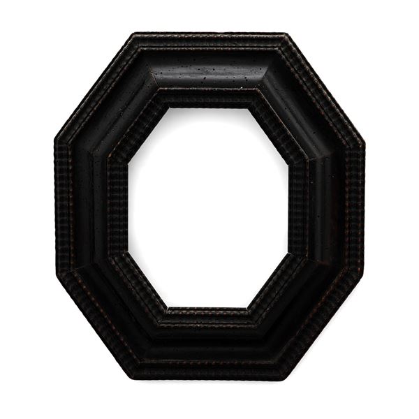 Cornice guillochè di forma ottagonale in legno intagliato ed ebanizzato. XVII-XVIII secolo